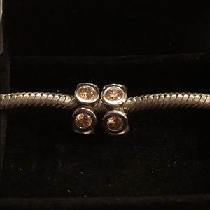 Two Pandora honey stone spacers